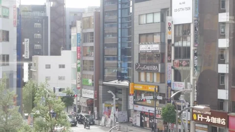 Landscape view through JR train window while train commuter moving pass tok.. Stock Footage 315384834