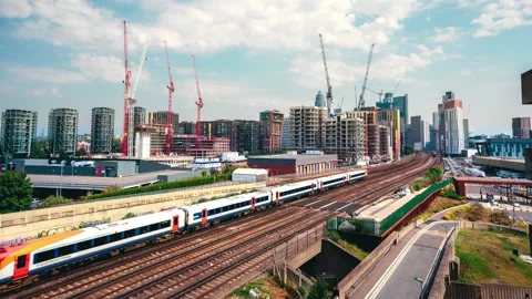 Landscape view of trains going to Waterloo station at New Covent Garden Market. Stock Footage 138398271