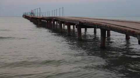 Landscape view of Tranquil Sunrise on the sea with wooden pier. Stock Footage 80221202