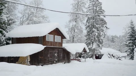 Landscape view of the two houses filled with snow Stock Footage 59687594