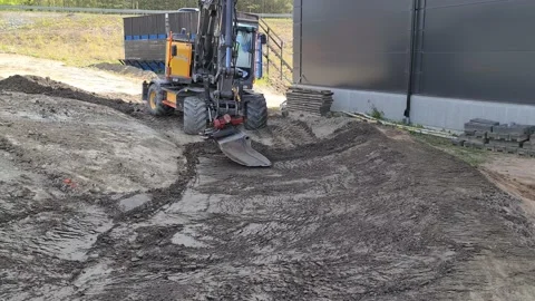 Landscape view with two workers watching excavator machines working. Stock Footage 137829999
