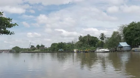 Landscape view of unfunctional old port of Banjarmasin Stock Footage 142122624