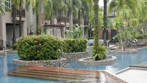 Landscape view of the warm relax swimming pool with tropical trees in moder.. Stock Footage 312166460