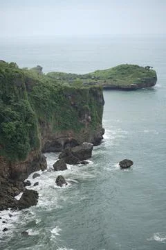 Landscape views of cliffs and waves crashing into the reef. Very dangerous .. Stock Photos