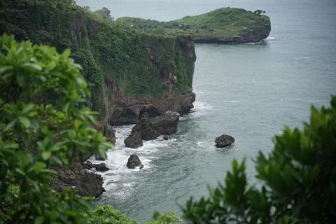 Landscape views of cliffs and waves crashing into the reef. Very dangerous .. Stock Photos