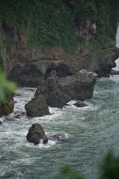 Landscape views of cliffs and waves crashing into the reef. Very dangerous .. Stock Photos