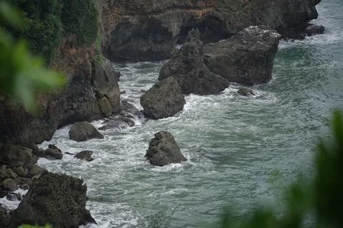 Landscape views of cliffs and waves crashing into the reef. Very dangerous .. Stock Photos