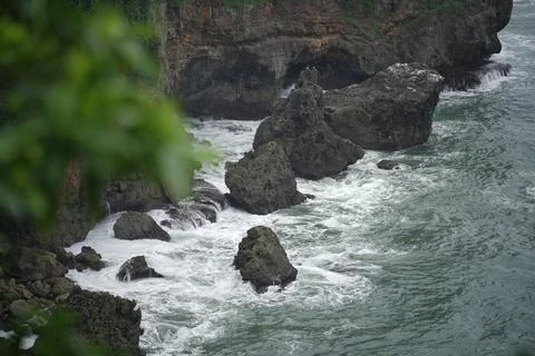 Landscape views of cliffs and waves crashing into the reef. Very dangerous .. Stock Photos