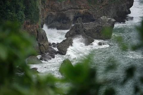 Landscape views of cliffs and waves crashing into the reef. Very dangerous .. Stock Photos