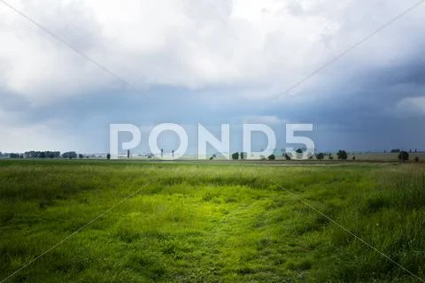 Landscape with village before the rain Stock Photos