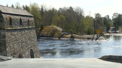 Landscape with the wall of a medieval castle and the river Stock Footage