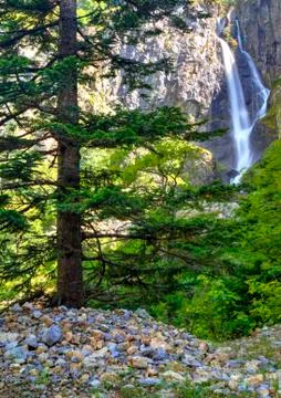 Landscape with waterfall in the mountain Stock Photos