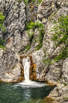 Landscape with waterfall in the mountain Stock Photos
