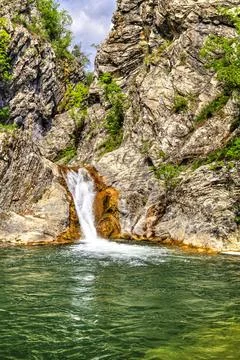 Landscape with waterfall in the mountain Stock Photos