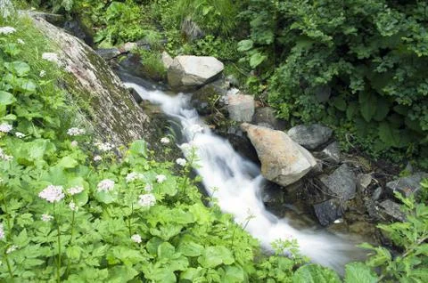Landscape with waterfall in the mountains Stock Photos