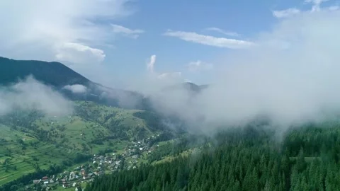 Landscape with white clouds and green wood and mountain Stock Footage 320244435