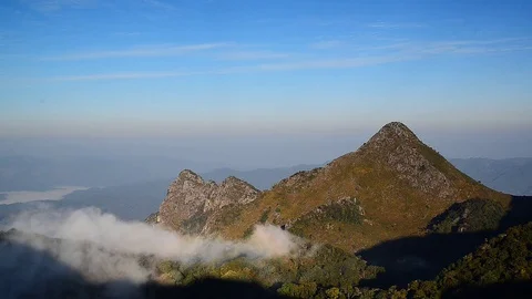 Landscape of white clouds over mountain on top Doi Luang Chiang Dao, Thailand Stock Footage 76637280