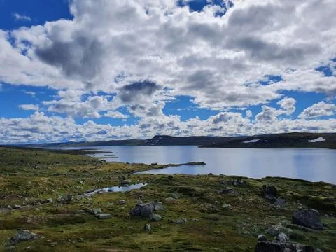 Landscape with white clouds in the sky Stock Photos