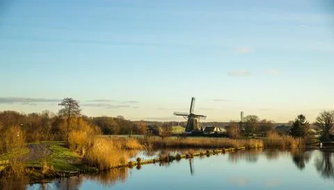Landscape with windmill Stock Photos