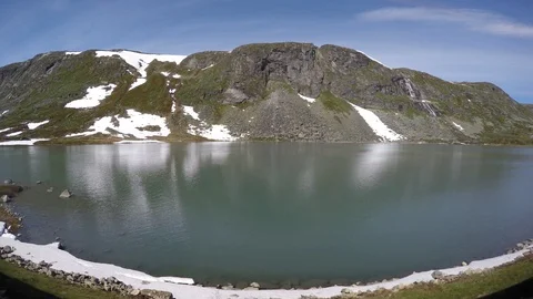 Landscape from the window of the train in Norway. The train passes near lake Видео 91874039