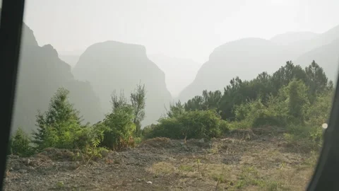 Landscape from the window of a van overlooking the mountains Stock Footage 297792517