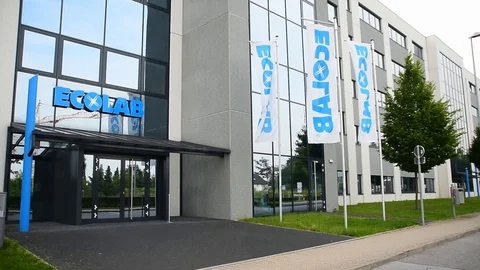 Langenfeld, Germany May 26th 2019: Waving flags at Ecolab office building Stock Footage 108643038