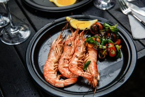 Langoustines cooked with vegetables. Stock Photos