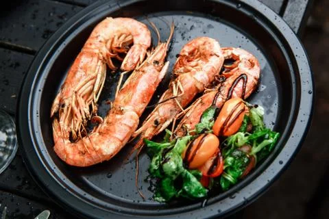 Langoustines cooked with vegetables. Stock Photos