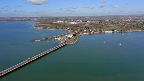 Langstone Bridge over the Harbour towards the Sailing Club Aerial Video stock 172046525