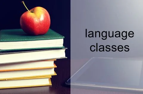 Language classes apple book stack Stock Photos