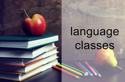 Language classes apple book stack Stock Photos