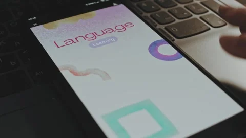 Language learning inscription on white background on smartphone screen. Graphic Stock Footage 270499534