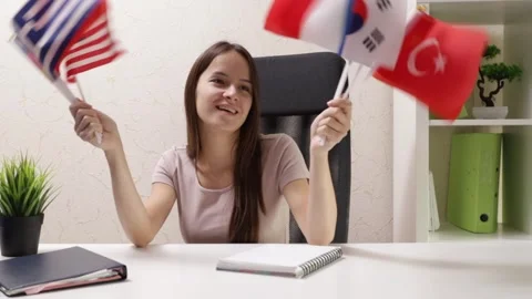 Language learning, student with foreign flags at language school Stock Footage 253577837