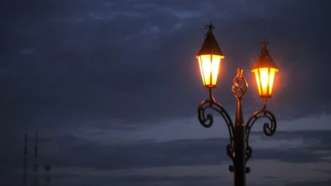 Lantern against the background of the evening sky. A fragment of the metal base Video stock 136211486