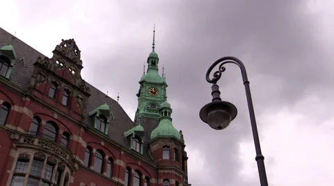 Lantern against a building and  floating clouds Stock Footage 38130247