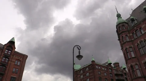 Lantern against a building and  floating clouds Stock Footage 38395470