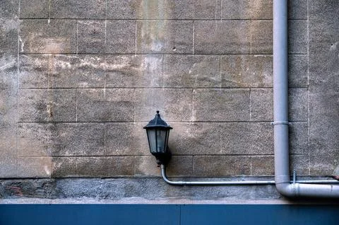 Lantern and drainpipe. Stock Photos