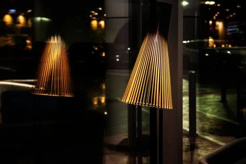 Lantern and its reflection in a dark room Stock Photos