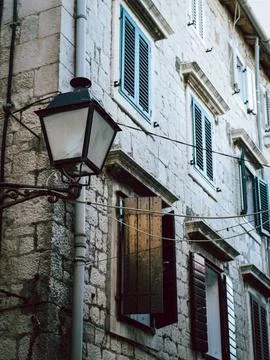 Lantern on the background of an old house Stock Photos