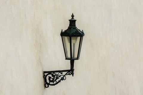 Lantern on a beige wall. Stock Photos