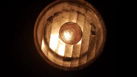 The lantern on the bike glows flicker in the dark. Close-up. Stock Footage 282304368