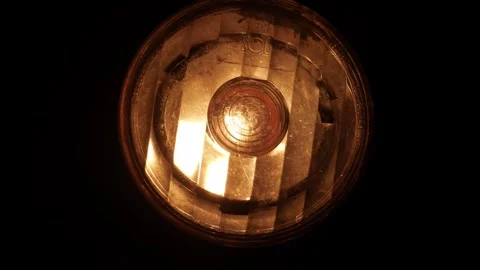 The lantern on the bike glows flicker in the dark. Close-up. Stock Footage 282304553