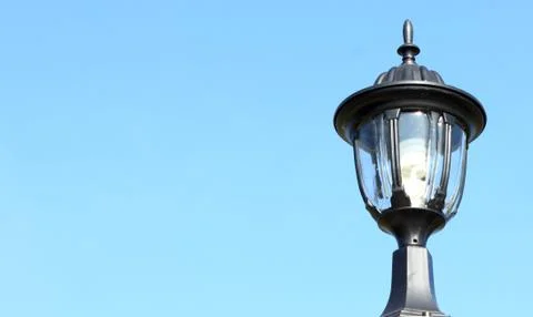 Lantern on a blue sky background Stock Photos