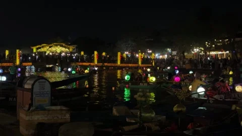 Lantern Boats Floating on Thu Bon River During Night Festival in Hoi An Vietnam Stock Footage 336411257