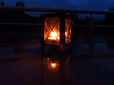 Lantern with burning candle Stock Photos
