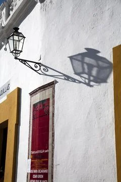 Lantern Casting Shadows on the Wall of the Maestranza Bullring in Seville Stock Photos