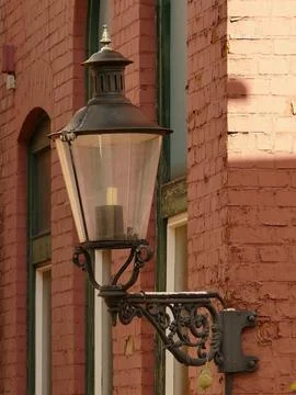 Lantern on the corner of the house Stock Photos