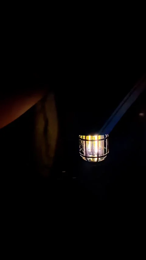 Lantern in the dark with a yellow light on a door Stock Footage 300172074