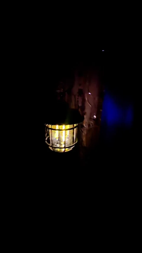 Lantern in the dark with a yellow light on a door Stock Footage 300172075
