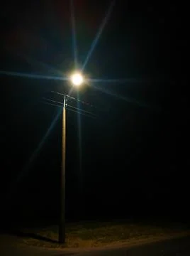 Lantern in the darkness over the road Stock Photos